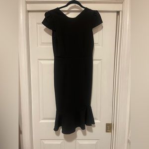 New with tags Betsey Johnson fitted black dress. Just below the knee.